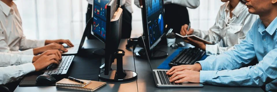 Analyst working on BI dashboard on computer monitor. Trailblazing Stock Photos