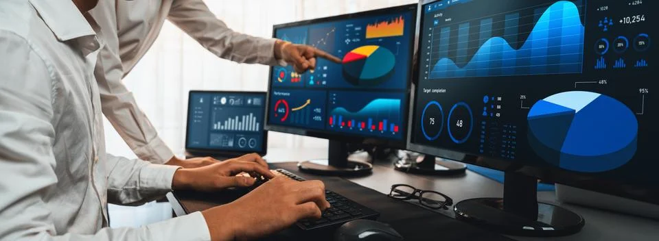 Analyst working on BI dashboard on computer monitor. Trailblazing Stock Photos
