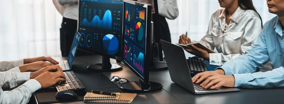 Analyst working on BI dashboard on computer monitor. Trailblazing Stock Photos
