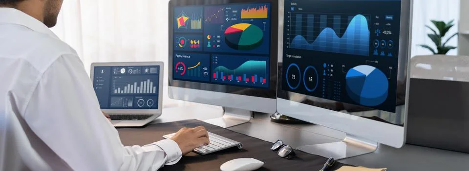Analyst working on data analysis BI dashboard on computer monitor.Trailblazing 스톡 사진