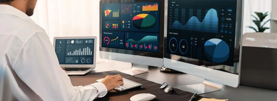 Analyst working on data analysis BI dashboard on computer monitor.Trailblazing Stock Photos