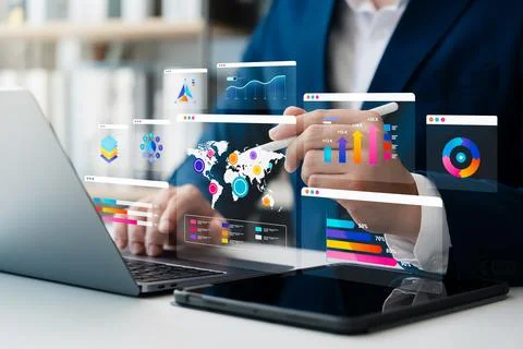 Analysts use laptops and tablets to analyze business data or dashboards, ma.. Stock Photos