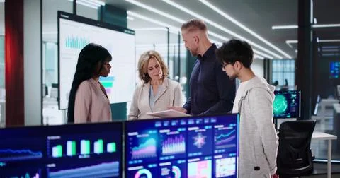 Analytic Team Of Diverse Professionals Meet For Business Data Analysis. Stock Photos