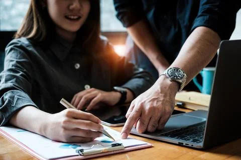 Analytics intelligence concept. Group of business people discuss current Stock Photos