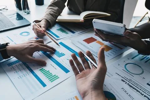 Analytics intelligence concept. Group of business people discuss current Stock Photos