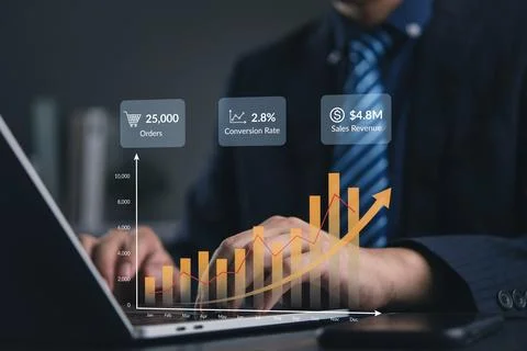 Analytics, sales manager reviews a dashboard on a laptop in office to track.. Stock Photos