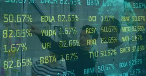 Analytics team analyzing financial percentages on transparent screen in office, Stock Photos
