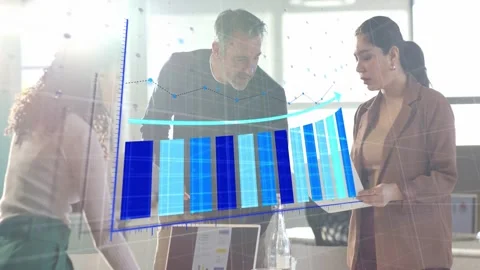 Analytics team opening laptop and pointing at reports, causing 3D blue chart Stock Footage 333733387