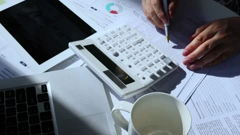 Analyze and count data with a calculator Stock Footage 236193156