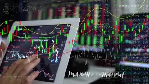 Analyze trading stocks with a tablet Stock Footage 167985015