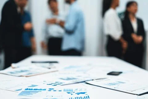 Analyzed financial data visualized papers on meeting table. Prudent Stock Photos