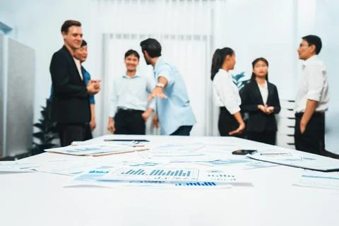Analyzed financial data visualized papers on meeting table. Prudent Fotos de archivo