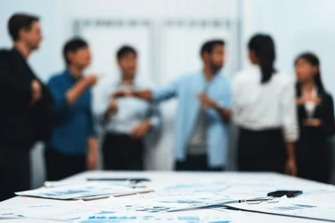 Analyzed financial data visualized papers on meeting table. Prudent Stock Photos