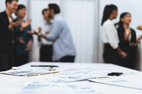 Analyzed financial data visualized papers on meeting table. Prudent Stock Photos