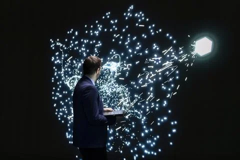 Analyzing AI, laptop and software developer looking at LLM node clusters 写真素材