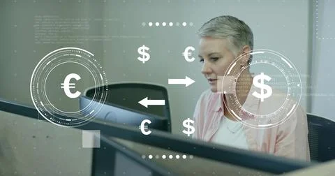 Analyzing analyst in pink top examining monitor with euro to dollar graphics at Stock Photos