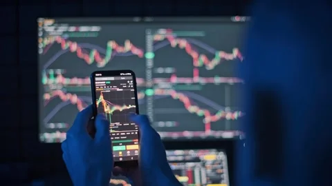 Analyzing Bitcoin on Mobile Stock Footage 303708814