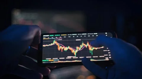 Analyzing Bitcoin Price on Phone Stock Footage 290948230