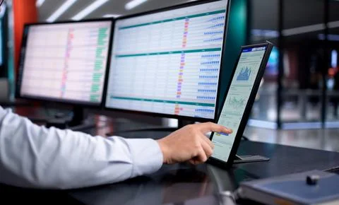 Analyzing Business Data On Computer, Financial Advisor Reviews Spreadsheet An Stock Photos