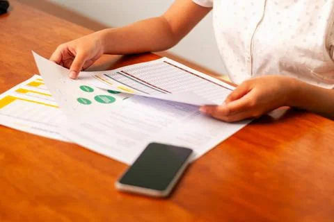 Analyzing business reports office documents table bright environment close-.. Fotos de archivo