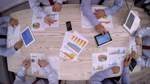 Analyzing charts at meeting Video stock 209874812