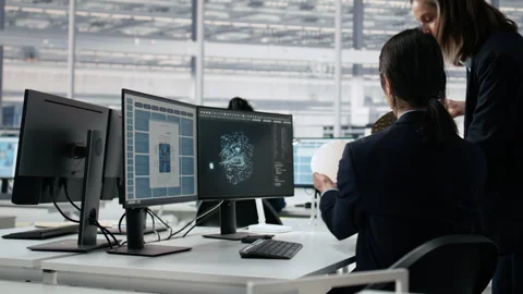Analyzing chip architecture, neural network AI and expert in microchip factory Stock Footage 335881843