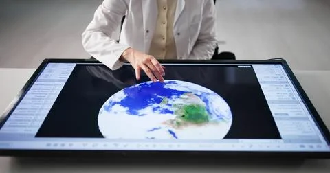 Analyzing Climate Data With Colleagues In The Research Laboratory Station. Stock Photos