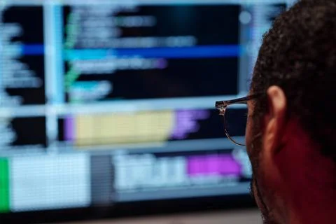 Analyzing Code on Computer Screen with Focused Mind Stock Photos