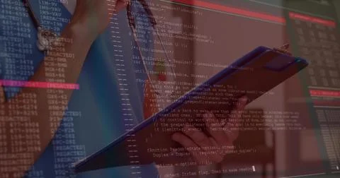 Analyzing code, developer wearing blue shirt and wristwatch holding tablet in 스톡 사진