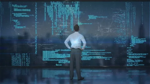 Analyzing complex data, man using animation on digital screen in office Stock Footage 303528657