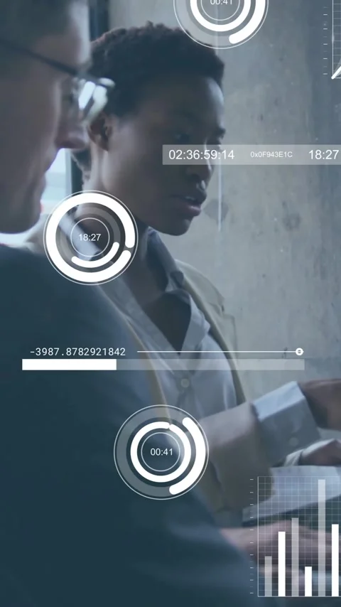 Analyzing data, business professionals using digital graphs and charts in office Stock Footage 344370314