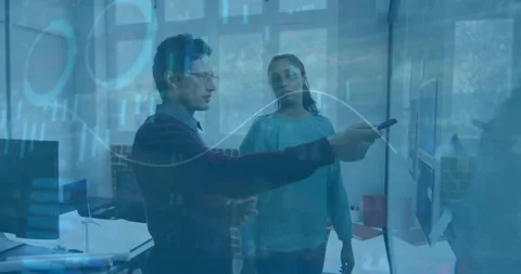 Analyzing data charts animation over business professionals discussing in office Stock Footage 327786266