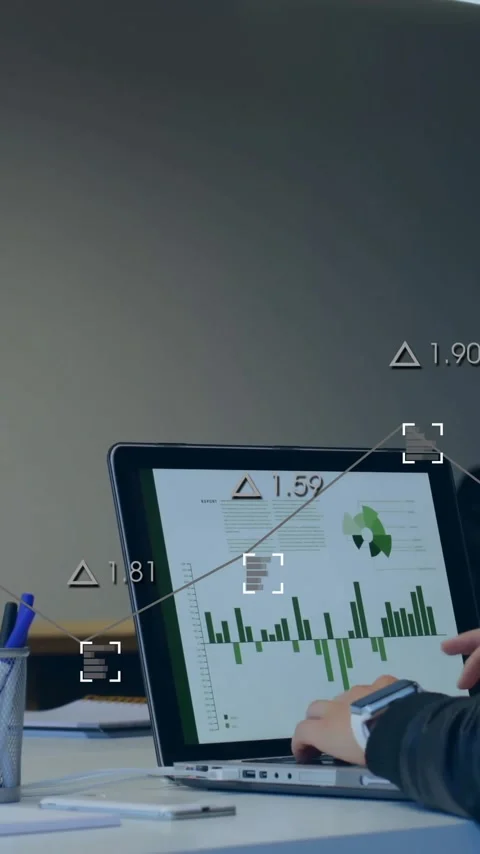 Analyzing data with digital graphs overlay, business team using laptops in Stock Footage 344244795