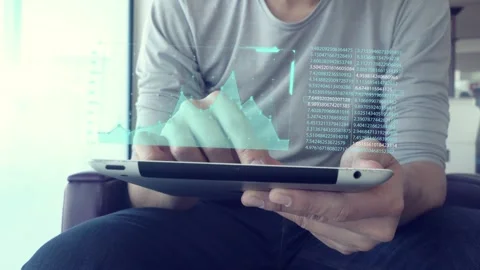 Analyzing Data on a Digital Tablet Stock Footage 315975757