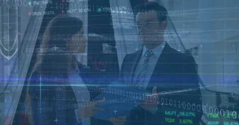 Analyzing data with folder and binder, colleagues in suits viewing digital Stock Photos
