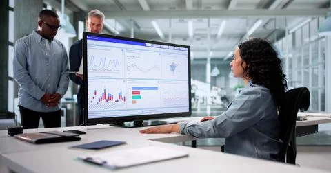 Analyzing Data On KPI Dashboard: A Multicultural Team In Business Stock Photos
