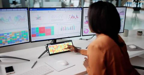 Analyzing Data At Office: Woman Using Heatmap Software On Computer 写真素材