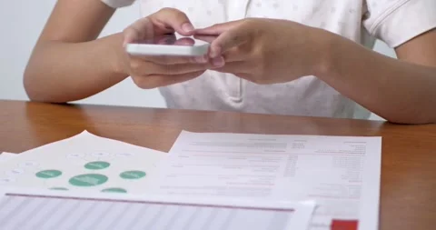 Analyzing data reports office setting digital engagement indoor close-up Stock Footage 313935262