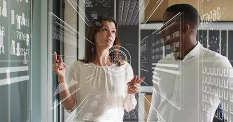 Analyzing data on screen, business professionals with futuristic interface image 库存插图