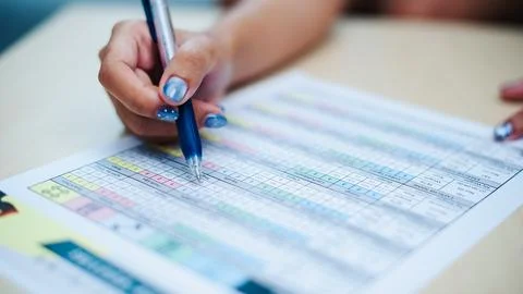 Analyzing data sheets office business document review indoor close-up effic.. Foto stock