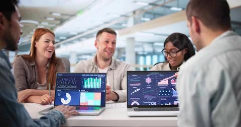 Analyzing Data With Team On Business Dashboard In Multicultural Office Stock Photos