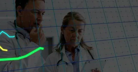 Analyzing data on trend grid, doctors using tablet and wearing stethoscopes in Stock Photos