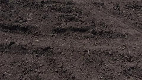 Analyzing the Different Patterns and Textures of Farm Soil Plowing in Stock Footage 313285723