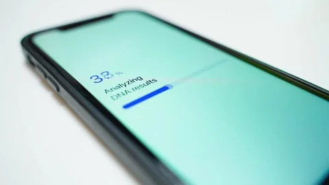 Analyzing DNA results progress on smartphone screen. Sample failed error message Stock Footage 343237830