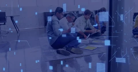 Analyzing documents, group of people sitting on floor with data processing Stock Footage 306637246