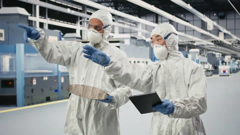 Analyzing electronic component, semiconductor and multiracial technicians Stock Footage 333393766
