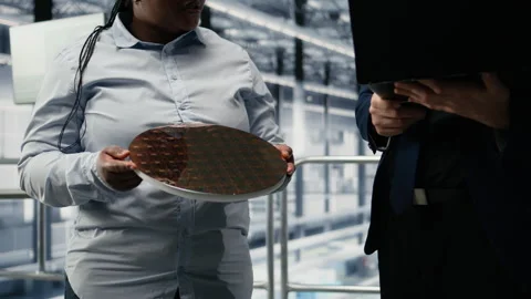 Analyzing electronic components, silicon wafer and researchers Stock Footage 333380487