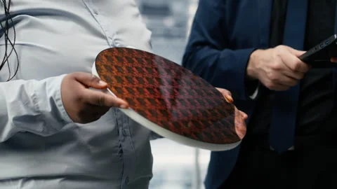 Analyzing electronic components, silicon wafer and researchers Stock Footage 333385443