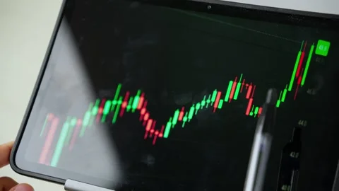 Analyzing Financial Chart on Tablet in Close Up Stock-Footage 347178965