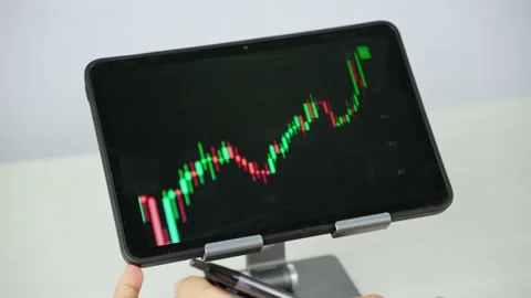 Analyzing Financial Chart on Tablet Video stock 347178955
